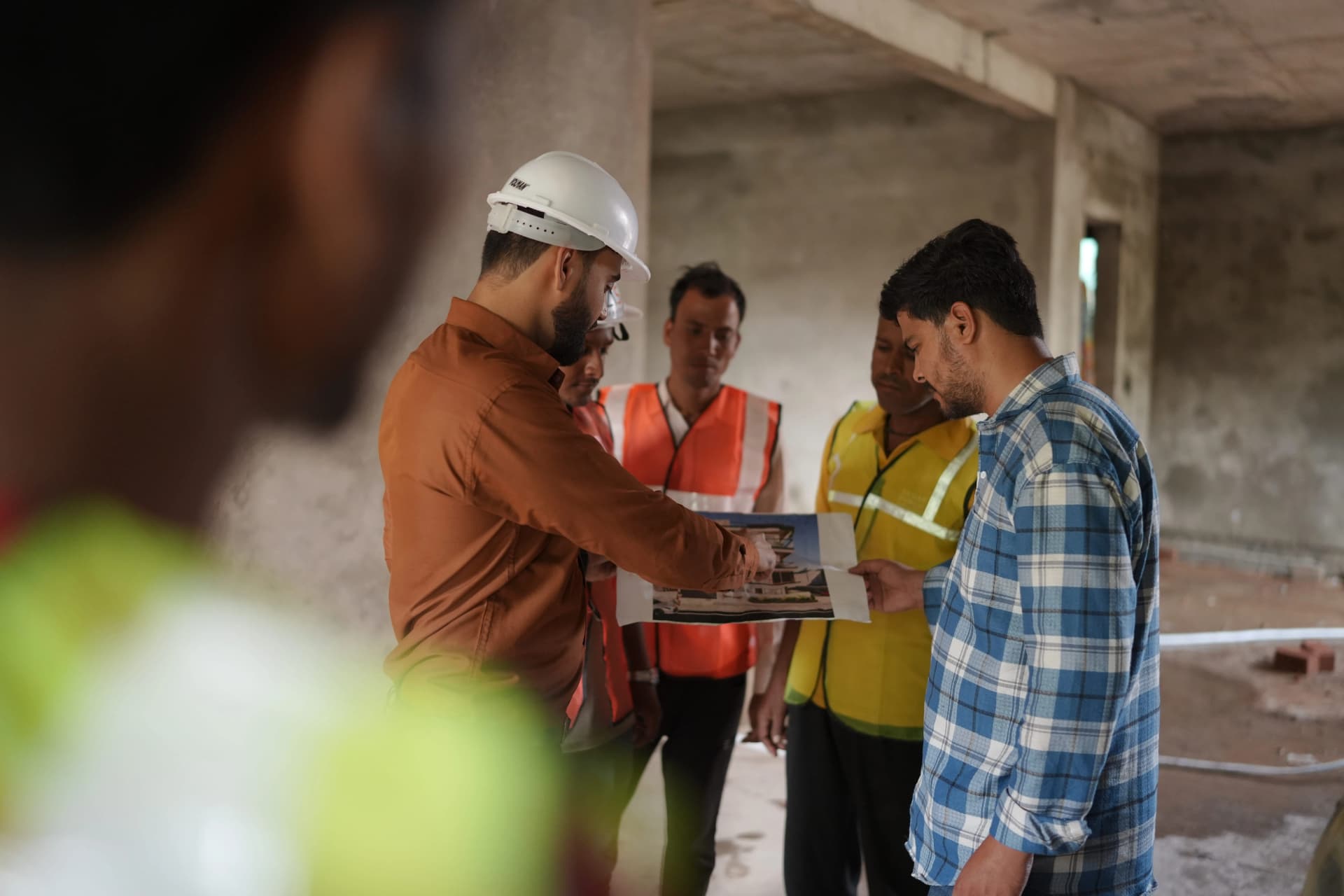 AS Infratech team reviewing construction plans